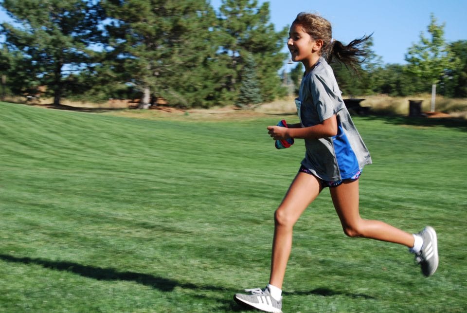 Girl running during the club greenwood Kids' Triathlon Run