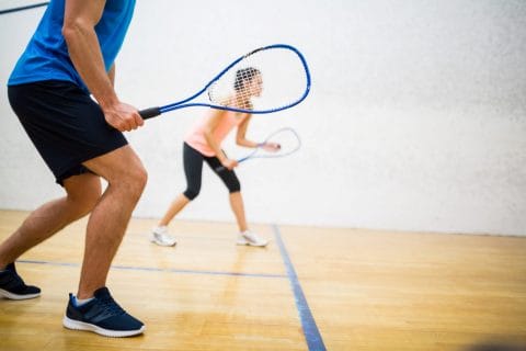 people playing squash with racquets