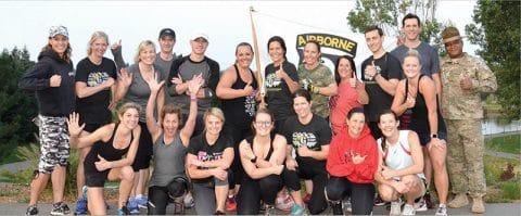 boot camp group photo with people smiling and doing a thumbs up outside in greenwood village park