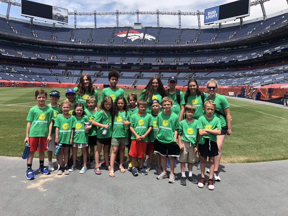 camp greenwood campers on the field at mile high broncos stadium