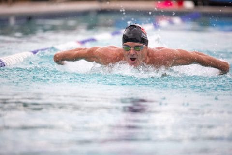 greg scott club greenwood masters coach swimming laps in outdoor pool doing a butterfly stroke