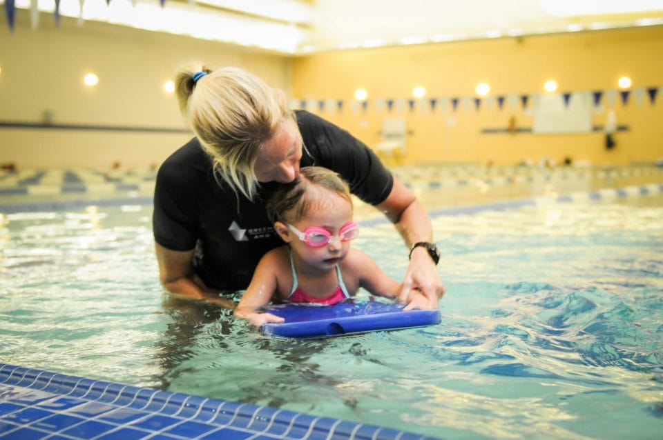 kid learning to swim with swim instructor jen barrow