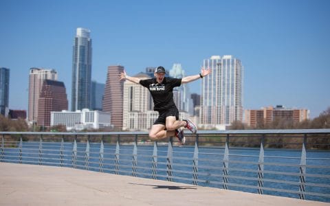 member coach gary stotler jumping by river