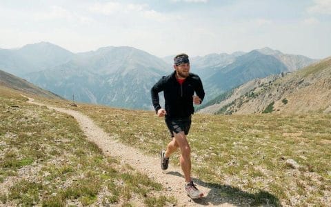 member coach gary stotler running in mountains