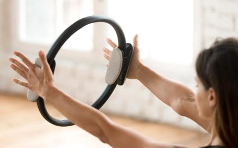 woman with pilates ring