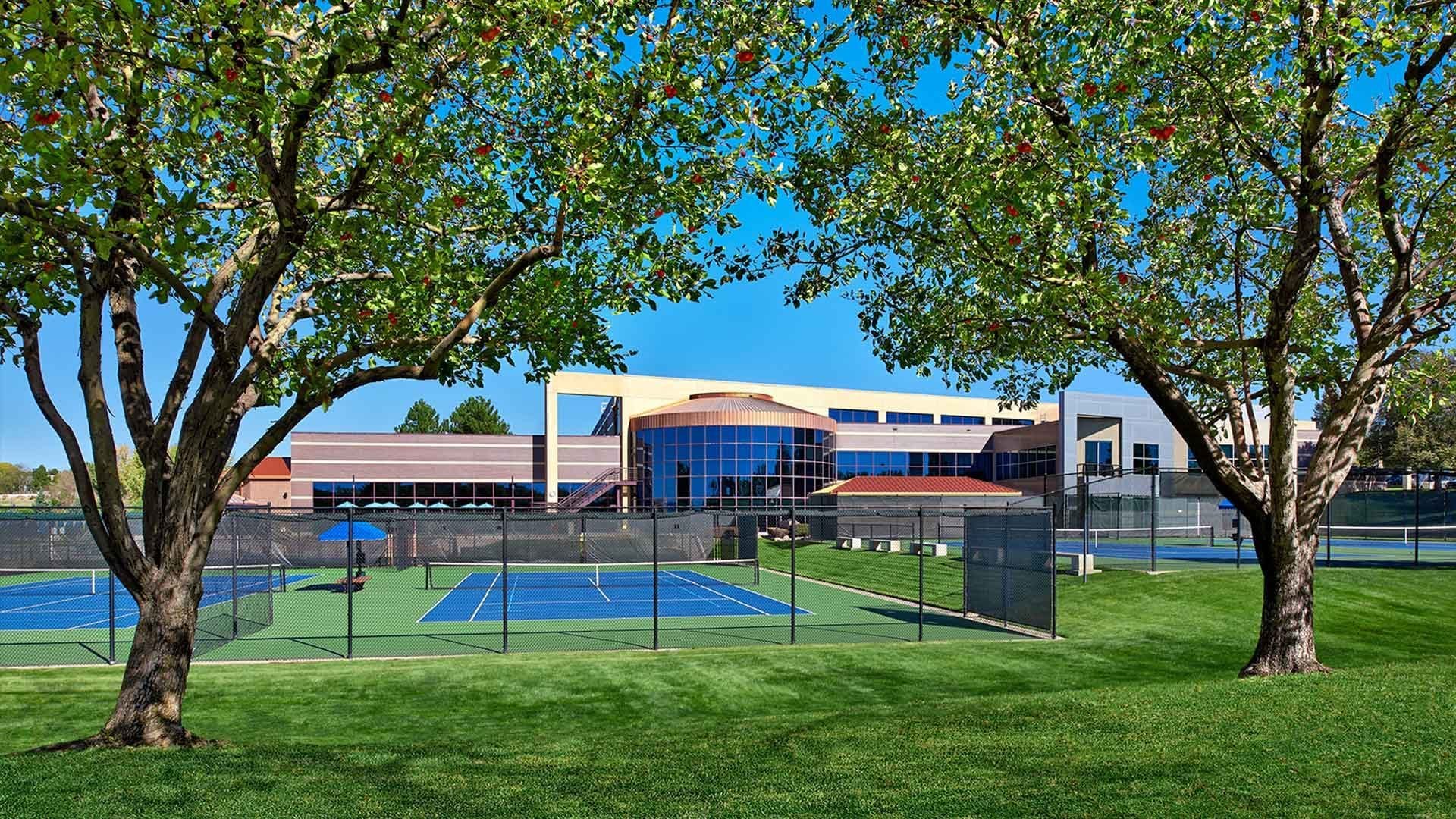 club greenwood facility and tennis courts in summertime