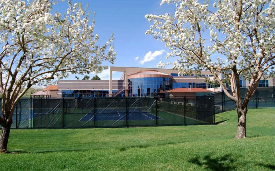 club greenwood facility in spring with blooming trees