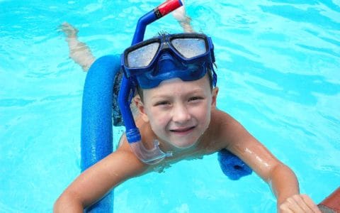 kid swimming in a pool