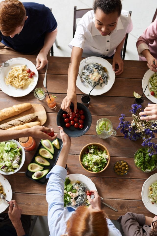 people sharing healthy food at a table