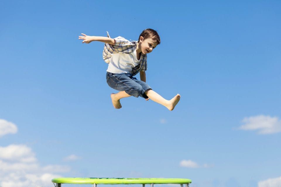 boy jumping on rebounder