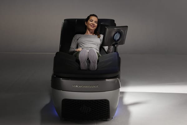 woman relaxing in a massage chair