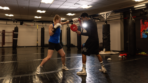 two people boxing inside a studio