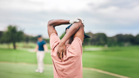 man stretching, golf