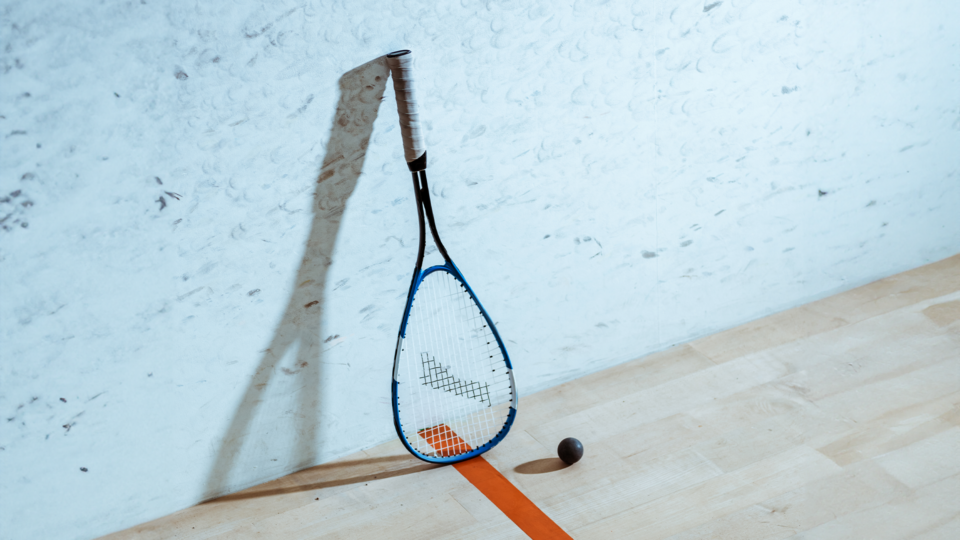Squash Racquet on the wall of a court