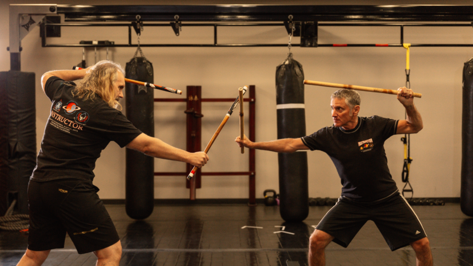 martial art instructors practicing JKD and Kali
