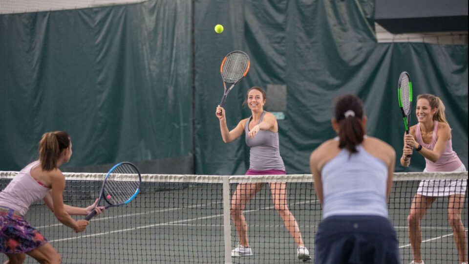 Ladies Playing Tennis Match