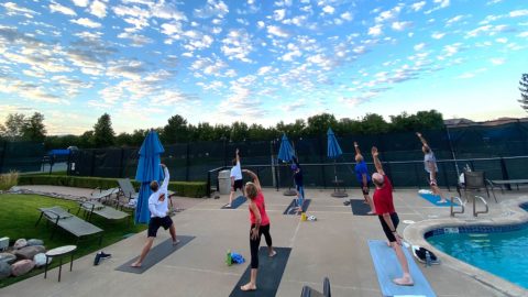 people doing yoga outside at club greenwood