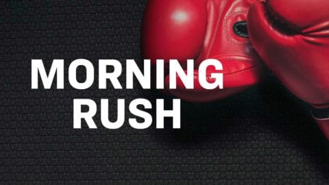 boxing gloves on a black surface with words that say morning rush