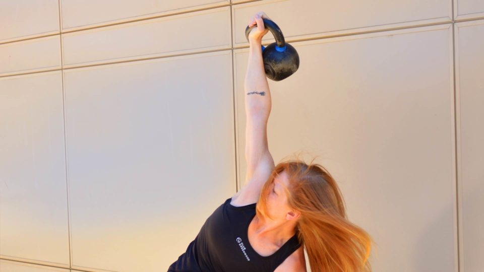 club greenwood personal trainer kim galbreath working out with a kettlebell outside