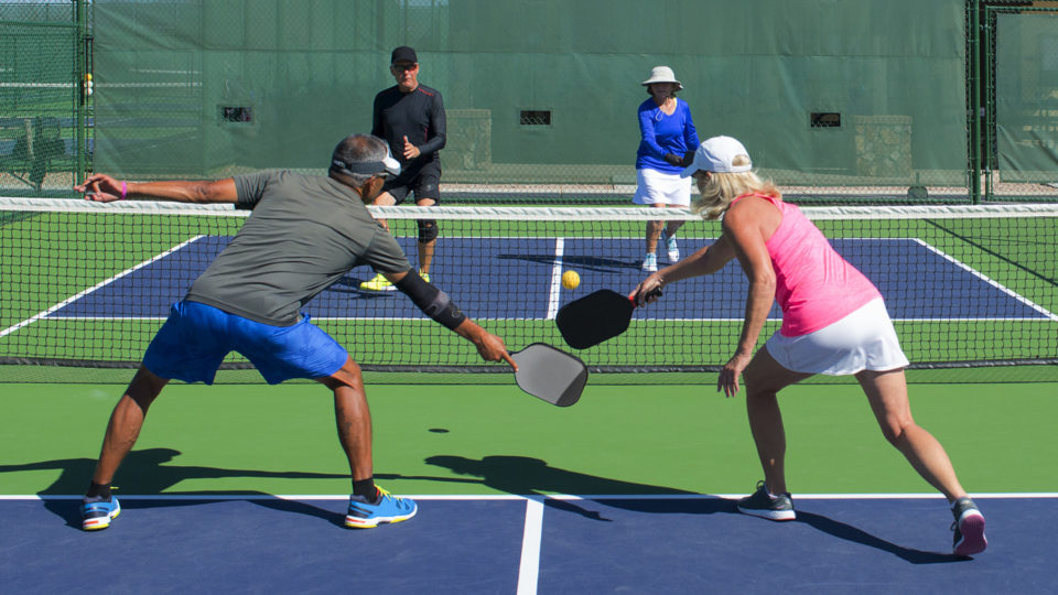 couples playing pickleball