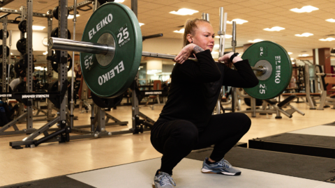club greenwood personal trainer abby derbyshire performing a front squat