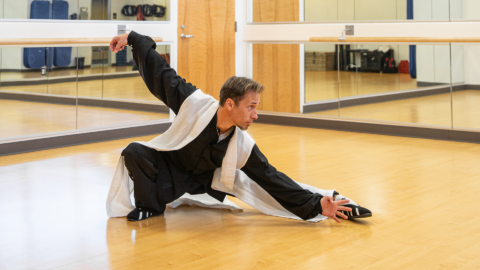 man performing qigong in a studio space