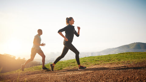 man and woman running outdoors, run club