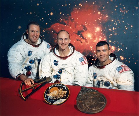 the crew of apollo 13 spacecraft wearing their space suits