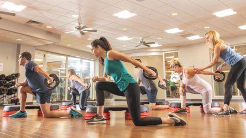 club greenwood members working out in a studio