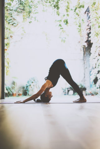 Woman in downward dog pose