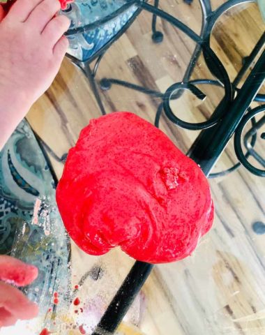 red slime on a glass table during daytime